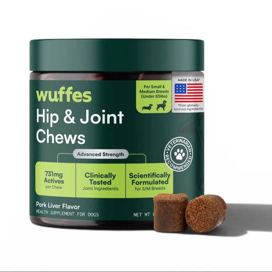 A dark green tub of wuffes Hip & Joint Chews for dogs, shown on a white background with two brown chew pieces in front of the container.